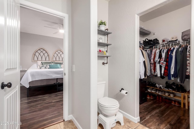 walk in closet with tile patterned flooring