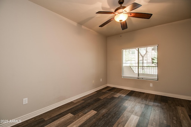 empty room featuring dark hardwood / wood-style floors and ceiling fan