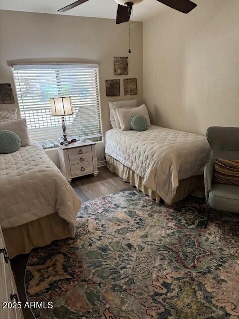 bedroom featuring light hardwood / wood-style flooring and ceiling fan