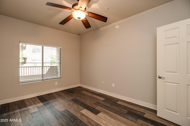 unfurnished room with dark hardwood / wood-style floors and ceiling fan