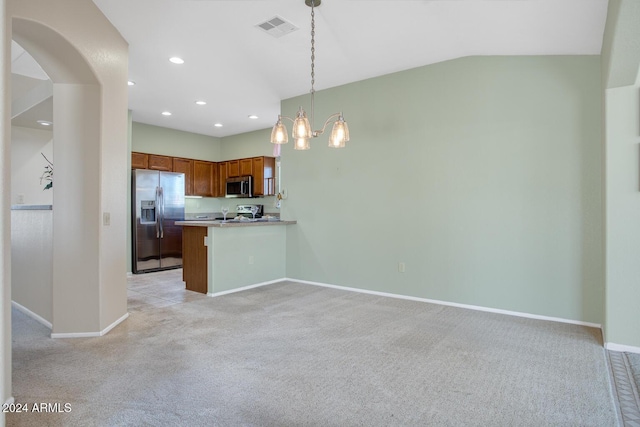 kitchen with stainless steel appliances, kitchen peninsula, lofted ceiling, decorative light fixtures, and light carpet