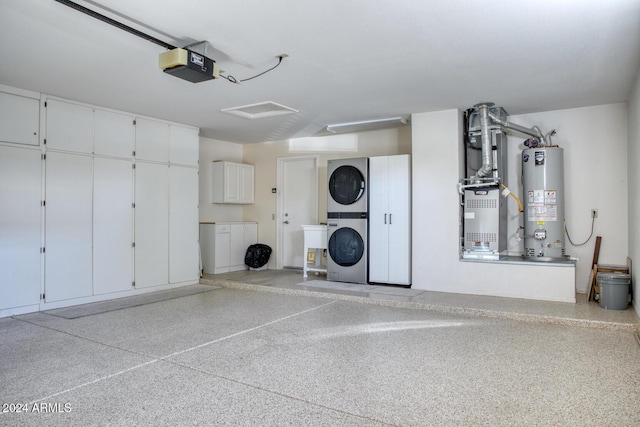 garage featuring gas water heater, a garage door opener, heating unit, and stacked washer / drying machine