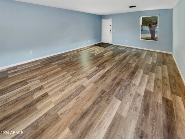 unfurnished room featuring hardwood / wood-style floors