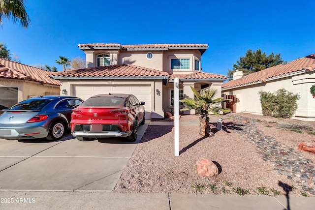 mediterranean / spanish house featuring a garage