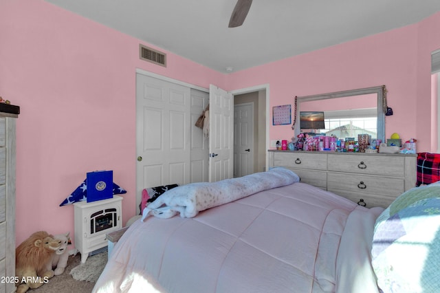 bedroom featuring carpet, ceiling fan, and a closet