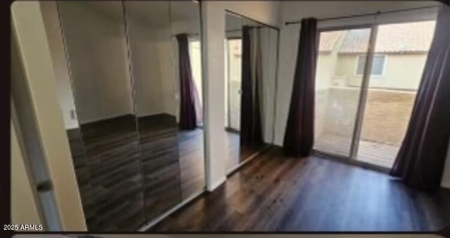 4601 N 102nd Ave Unit 2202, Phoenix, AZ 85037 - unfurnished bedroom featuring dark wood-type flooring