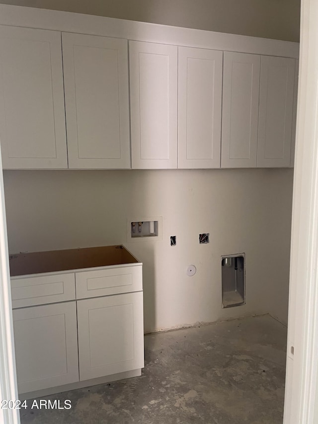 laundry room featuring gas dryer hookup, washer hookup, and cabinets