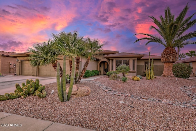 view of front of property with a garage