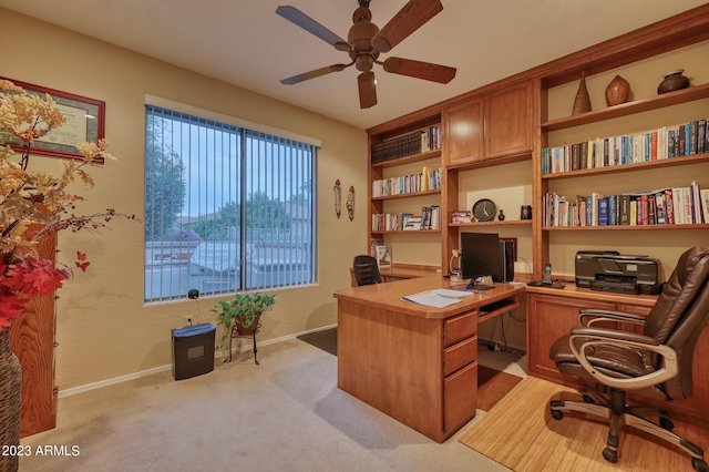 carpeted office with ceiling fan