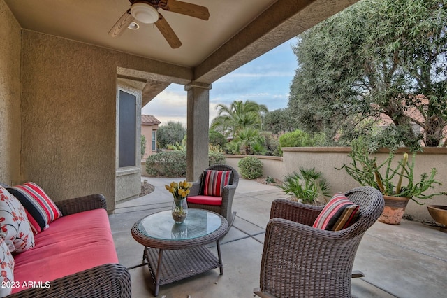 view of terrace with outdoor lounge area and ceiling fan