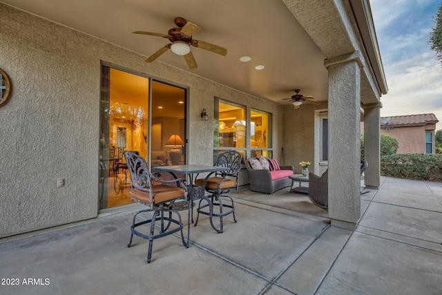 view of patio featuring ceiling fan