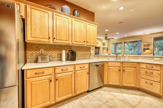 kitchen featuring ceiling fan, tasteful backsplash, stainless steel appliances, and light tile flooring