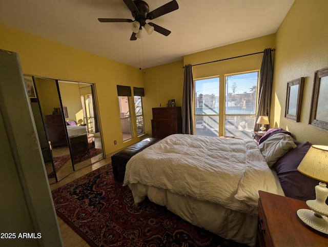 bedroom with tile patterned floors and ceiling fan