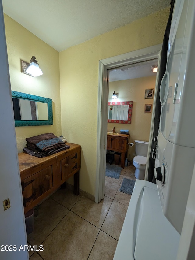 bathroom featuring tile patterned floors and toilet