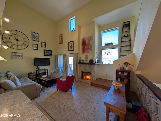 living room with light tile patterned floors and a towering ceiling