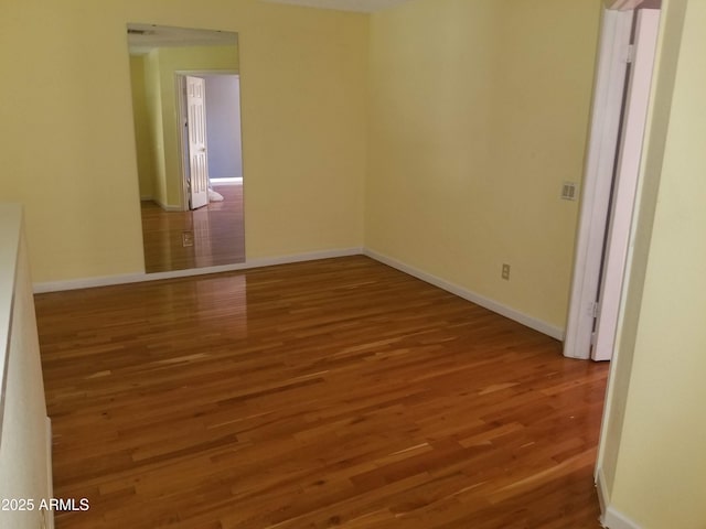 spare room featuring hardwood / wood-style floors