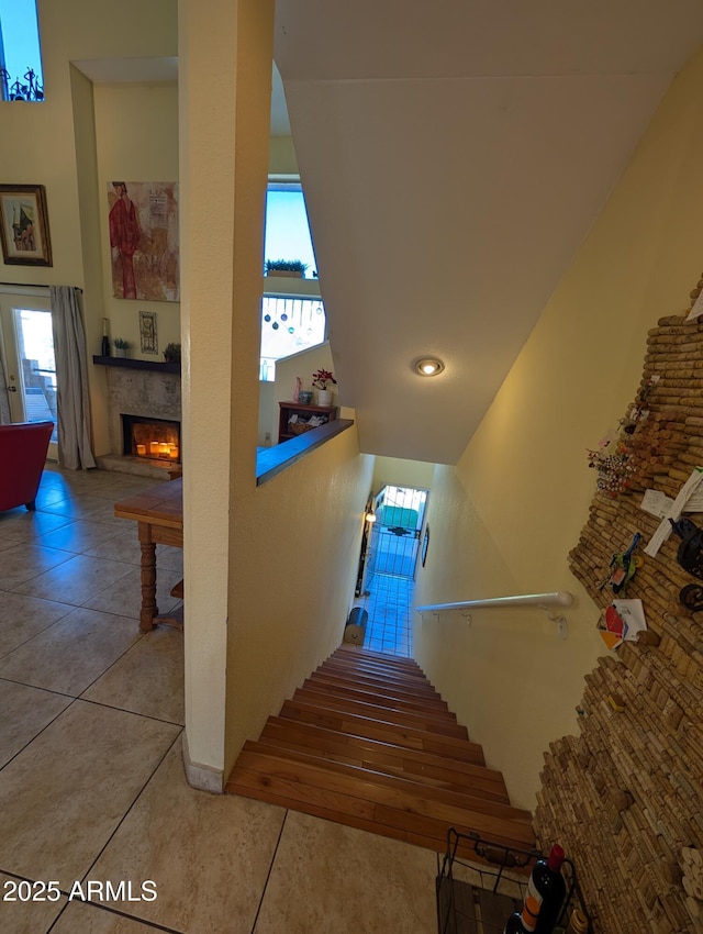 stairway featuring tile patterned flooring