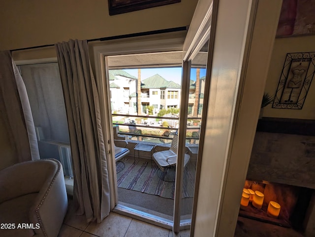 doorway to outside featuring light tile patterned floors