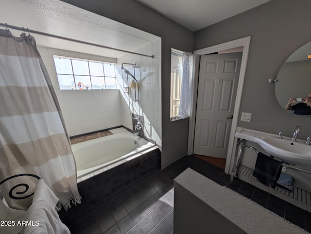 bathroom featuring tile patterned flooring and shower / tub combo