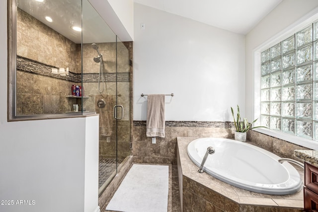 full bath with a shower stall and a bath