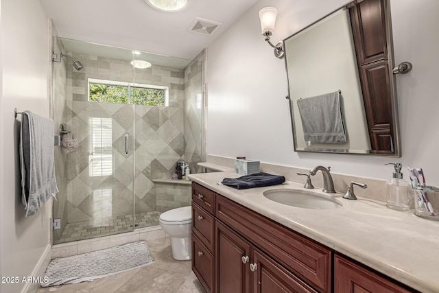 full bathroom featuring visible vents, toilet, a shower stall, and vanity