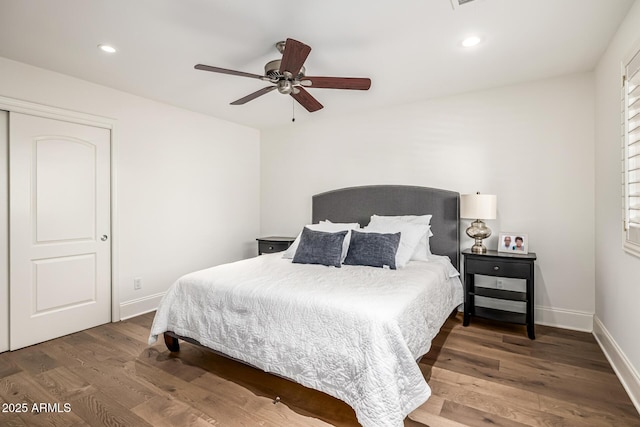 bedroom with baseboards, recessed lighting, ceiling fan, and wood finished floors