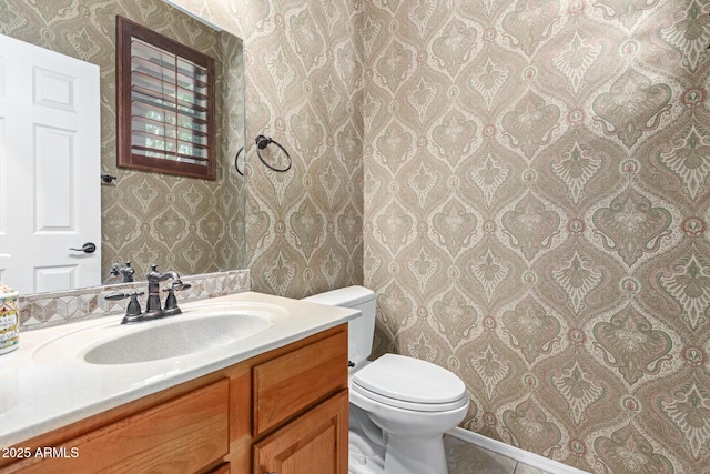 bathroom with vanity and toilet