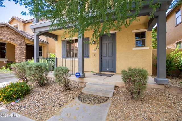 property entrance featuring covered porch