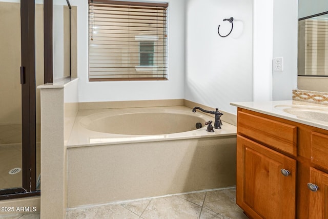 bathroom with separate shower and tub and vanity