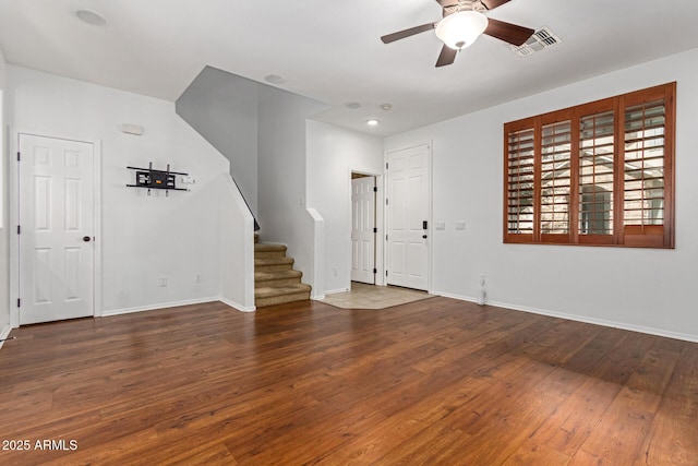 entryway with dark hardwood / wood-style floors and ceiling fan