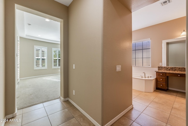 hallway with light tile patterned floors