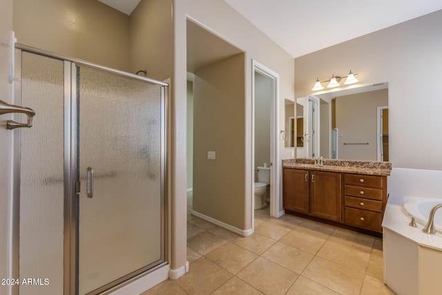 full bathroom featuring tile patterned floors, vanity, independent shower and bath, and toilet