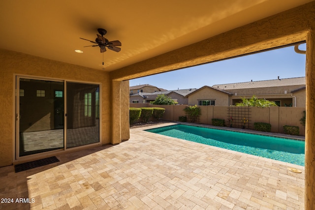 view of pool featuring ceiling fan and a patio