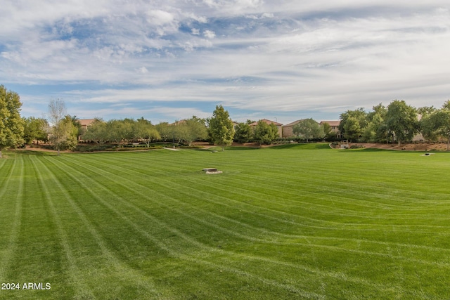 view of property's community with a lawn