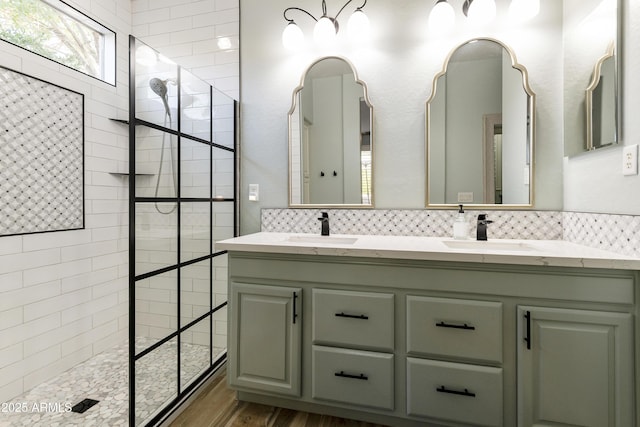 4524 E Narrowleaf Dr, Gilbert, AZ 85298 - full bath with a walk in shower, double vanity, wood finished floors, and decorative backsplash