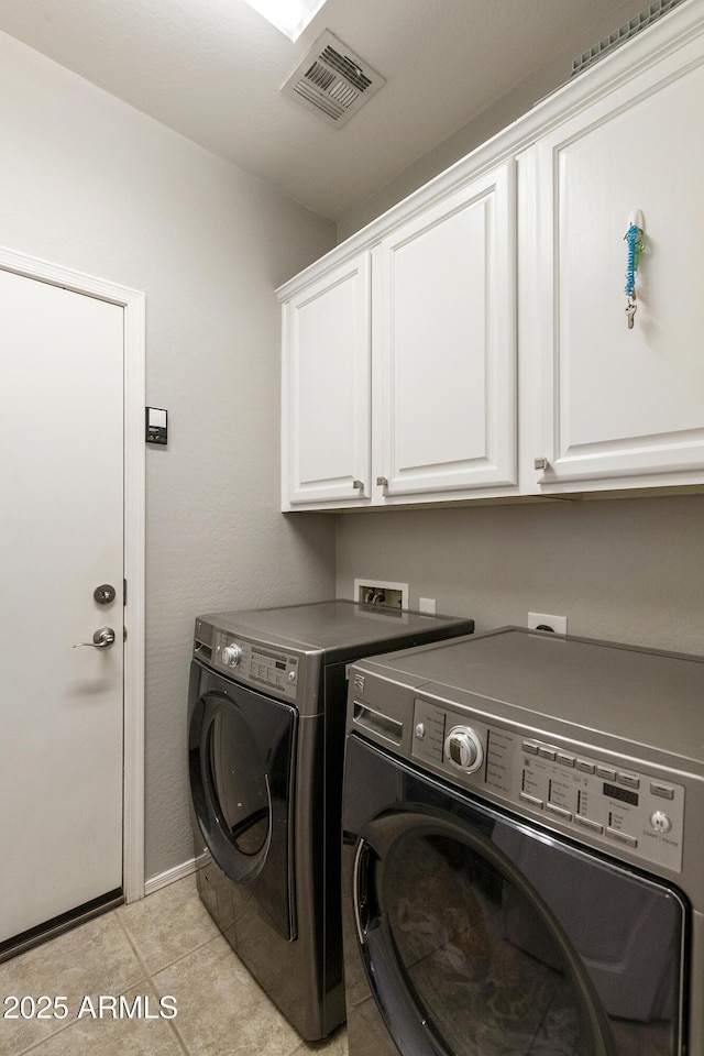 4524 E Narrowleaf Dr, Gilbert, AZ 85298 - laundry room featuring cabinet space, washing machine and dryer, and light tile patterned floors