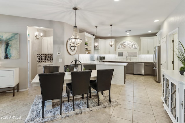 4524 E Narrowleaf Dr, Gilbert, AZ 85298 - dining room featuring a chandelier, light tile patterned flooring, and recessed lighting