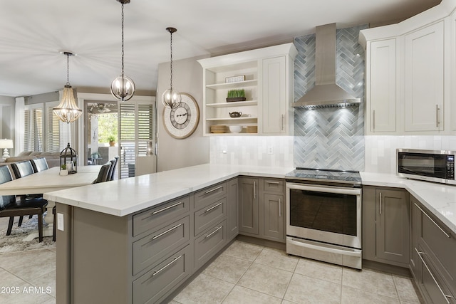4524 E Narrowleaf Dr, Gilbert, AZ 85298 - kitchen featuring appliances with stainless steel finishes, wall chimney range hood, gray cabinets, a chandelier, and open shelves