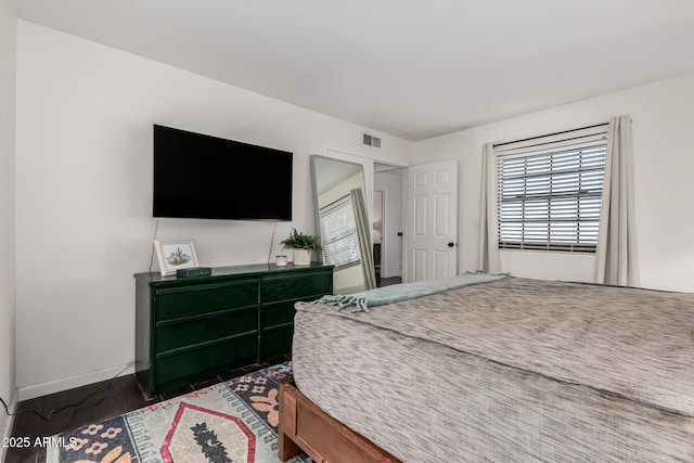 bedroom featuring dark wood-type flooring