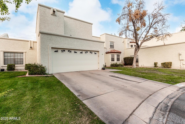 view of front of property with a garage and a front yard