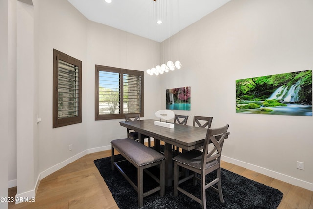 dining room featuring recessed lighting, baseboards, and light wood finished floors