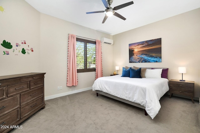 bedroom with baseboards, a wall mounted air conditioner, a ceiling fan, and light colored carpet