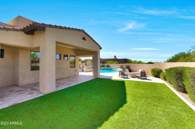 view of yard with a patio, a fenced backyard, and a fenced in pool