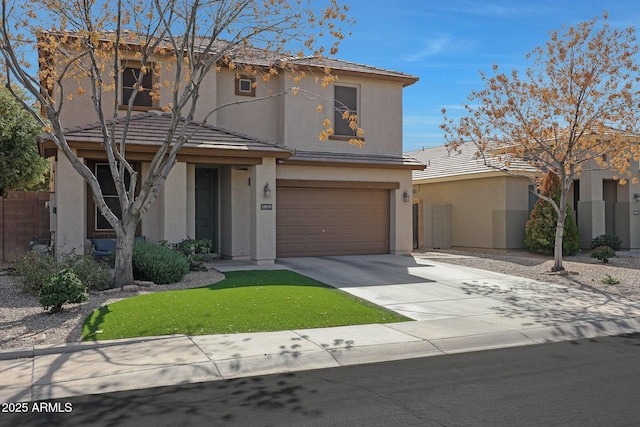 traditional-style house featuring an attached garage, a tiled roof, concrete driveway, and stucco siding