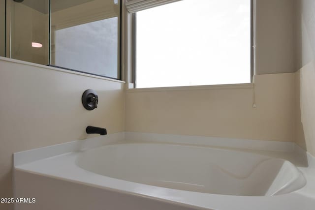 full bath with a shower and a garden tub