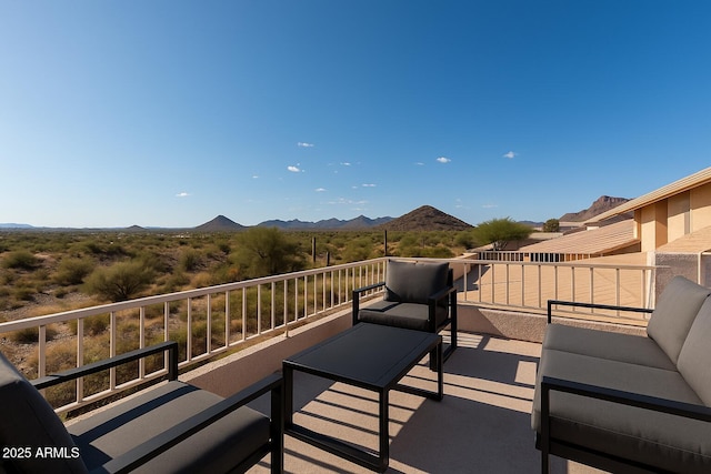 balcony with an outdoor hangout area and a mountain view