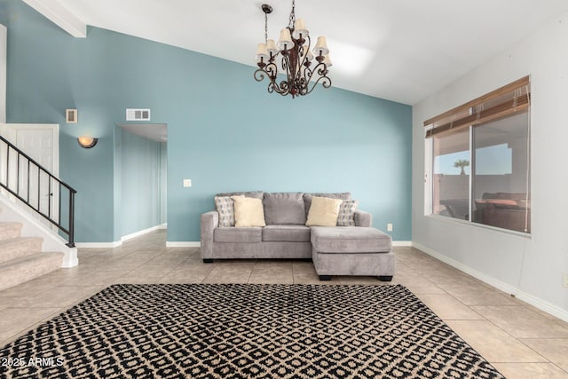 living area with tile patterned flooring, stairway, a chandelier, baseboards, and high vaulted ceiling