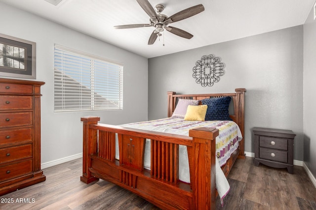 bedroom featuring wood finished floors, baseboards, and ceiling fan