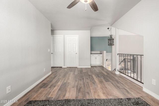 bonus room featuring a ceiling fan, wood finished floors, and baseboards