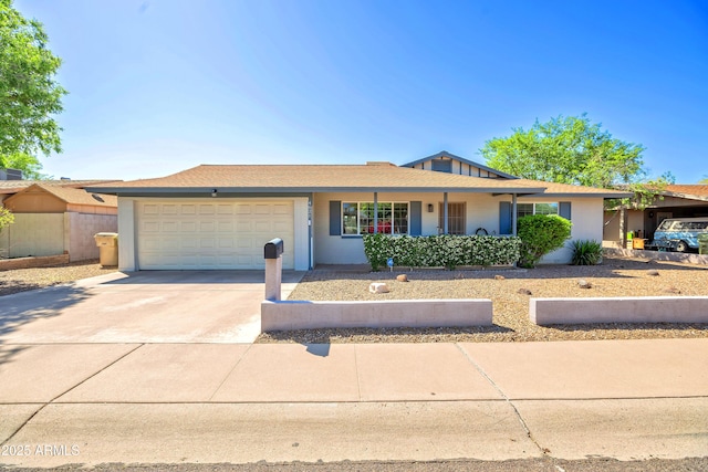 single story home with driveway, stucco siding, and an attached garage
